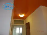 Опънати тавани за коридор София - лак оранж с пололей.