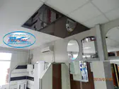 Кафяв огледален опънат таван в магазин в Пловдив.